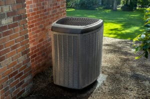 Environmentally friendly heat pump located in the back yard, HVAC Tune-Up.