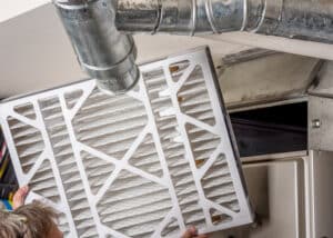 Home Furnace filter inspection for dirt and Furnace Repair.
