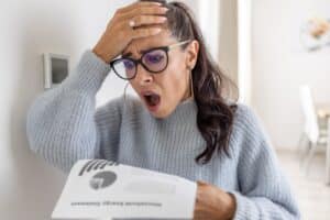 Woman is shocked from the rising energy Heating Costs.